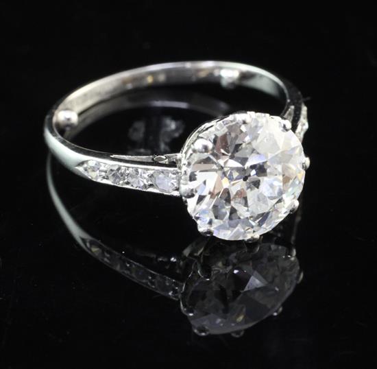 A 1940s/1950s platinum and single stone diamond ring with diamond set shoulders, size L.